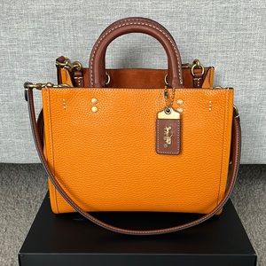 Coach rogue 25 in brass/papaya multi